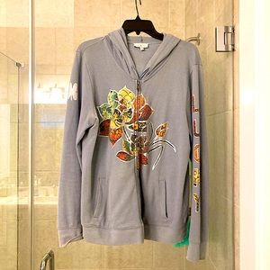 Lucky brand blue hoodie with colorful lettering on sleeve and front